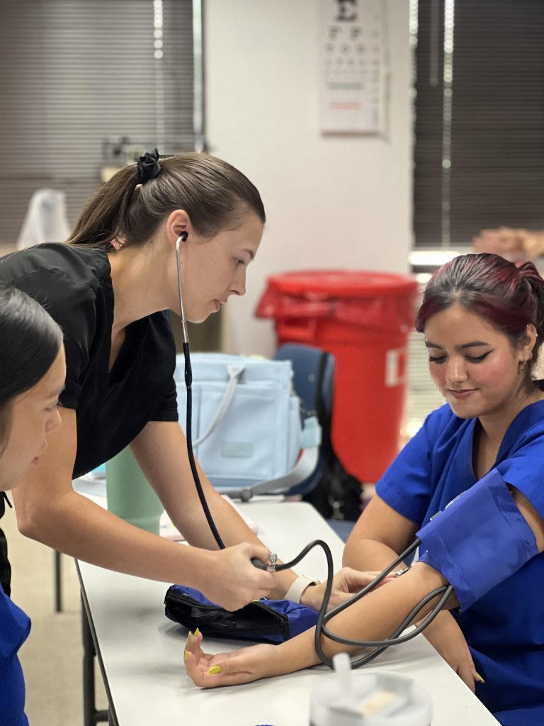 Medical Assistant Measuring Blood Pressure